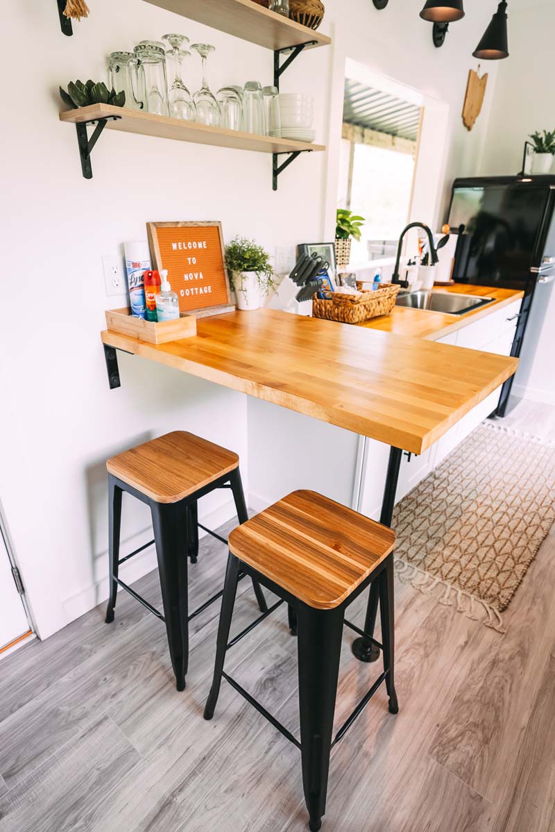 2 bar stools in table area in kitchen